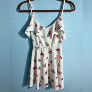 Short flowy flower dress. Tight on the torso and loose at the bottom.